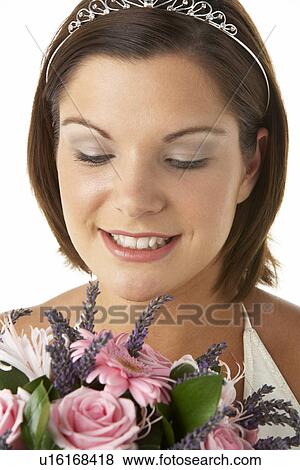 Stock Photo - Portrait Of Bride Holding Bouquet Of Flowers. Fotosearch