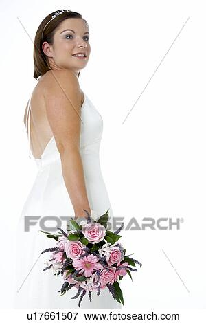 Stock Photo - Portrait Of Bride Holding Bouquet Of Flowers. Fotosearch