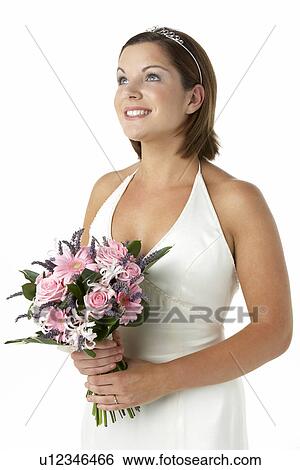 Stock Photograph - Portrait Of Bride Holding Bouquet Of Flowers. Fotosearch