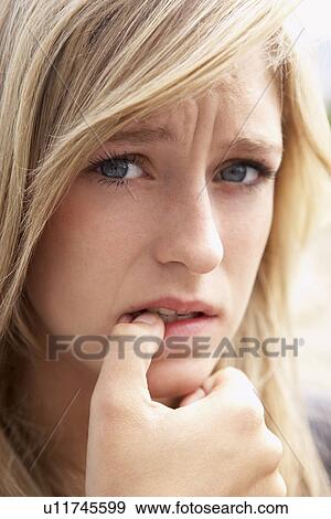 Portrait Of Girl Biting Nails View Large Photo Image Stock Photo - Portrait Of Girl Biting Nails. Fotosearch
