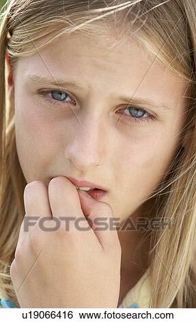Portrait Of Girl Biting Nails View Large Photo Image Stock Photograph - Portrait Of Girl Biting Nails. Fotosearch