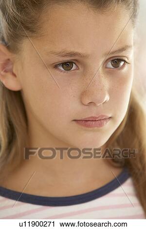 Stock Image - Portrait Of Girl Frowning. Fotosearch