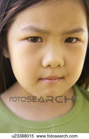 Stock Photography - Portrait Of Girl Frowning. Fotosearch