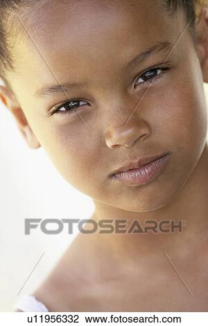 Stock Image - Portrait Of Girl Looking Angry. Fotosearch