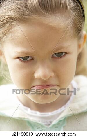 Stock Photo - Portrait Of Girl Pouting. Fotosearch