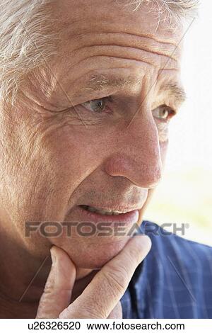 Stock Image - Portrait Of Middle Aged Man Looking Worried. Fotosearch