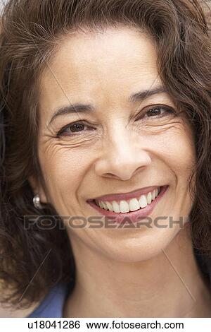 Portrait Of Middle Aged Woman Smiling At The Camera View Large Photo Image Stock Photograph - Portrait Of Middle Aged Woman Smiling At The Camera. Fotosearch