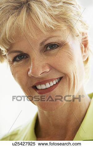 Portrait Of Middle Aged Woman Smiling At Camera View Large Photo Image Stock Photography - Portrait Of Middle Aged Woman Smiling At Camera. Fotosearch