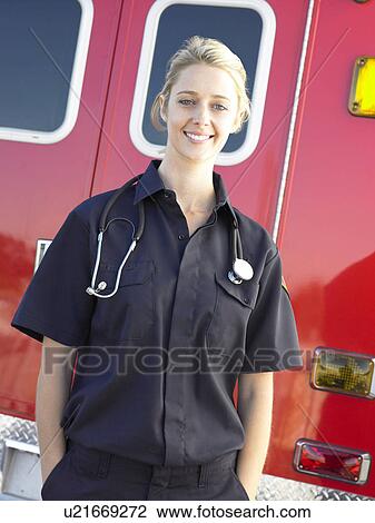 Portrait of paramedic in front of ambulance View Large Photo Image Stock Image - Portrait of paramedic in front of ambulance. Fotosearch