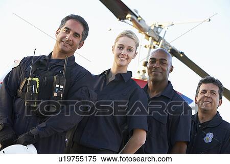 Portrait of paramedics standing in front of Medevac View Large Photo Image Stock Photography - Portrait of paramedics standing in front of Medevac. Fotosearch