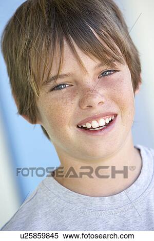Stock Photography - Portrait Of Pre-Teen Boy Smiling. Fotosearch