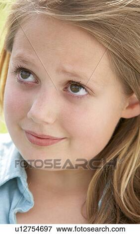 Portrait Of Pre-Teen Girl Looking Unsure View Large Photo Image Stock Photo - Portrait Of Pre-Teen Girl Looking Unsure. Fotosearch
