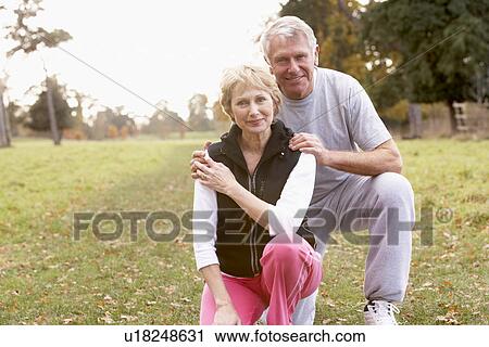 Portrait Of Senior Couple Crouching In The Park View Large Photo Image Stock Image - Portrait Of Senior Couple Crouching In The Park. Fotosearch