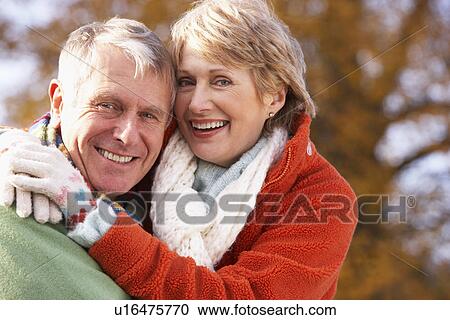 Stock Image - Portrait Of Senior Couple Hugging. Fotosearch