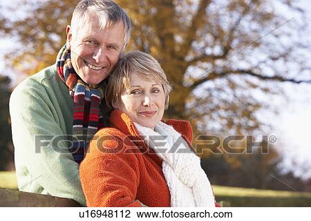 Stock Image - Portrait Of Senior Couple Hugging. Fotosearch