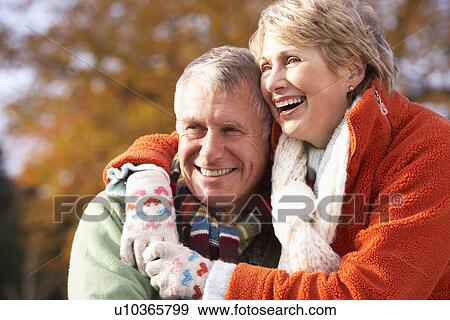 Stock Photo - Portrait Of Senior Couple Hugging. Fotosearch