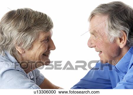 Portrait of senior couple smiling at each other View Large Photo Image Stock Image - Portrait of senior couple smiling at each other. Fotosearch
