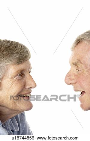 Portrait of senior couple smiling at each other View Large Photo Image Stock Photograph - Portrait of senior couple smiling at each other. Fotosearch