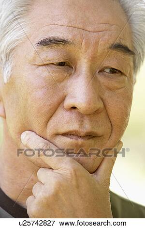 Stock Photo - Portrait Of Senior Man Looking Anxious. Fotosearch