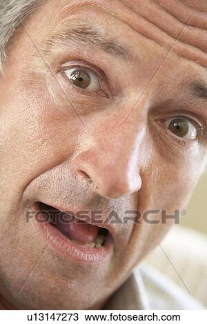 Portrait Of Senior Man Looking At Camera In Surprise View Large Photo Image Stock Image - Portrait Of Senior Man Looking At Camera In Surprise. Fotosearch