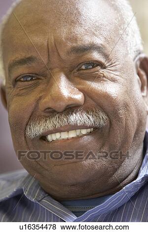 Stock Photo - Portrait Of Senior Man Smiling At The Camera. Fotosearch