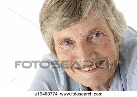 Portrait of senior woman smiling at the camera View Large Photo Image Picture - Portrait of senior woman smiling at the camera. Fotosearch