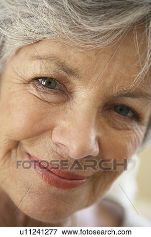 Stock Photo - Portrait Of Senior Woman Smiling At The Camera. Fotosearch