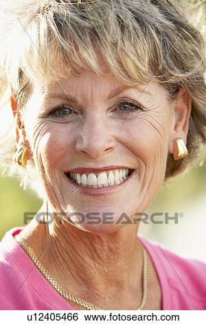 Stock Photograph - Portrait Of Senior Woman Smiling At The Camera. Fotosearch