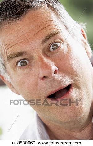 Stock Image - Portrait Of Surprised Middle Aged Man. Fotosearch