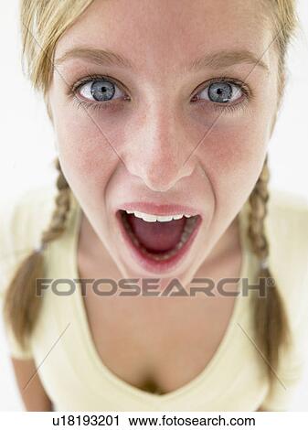 Stock Image - Portrait Of Teenage Girl Looking Shocked. Fotosearch