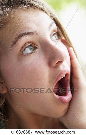 Stock Photo - Portrait Of Teenage Girl Looking Shocked. Fotosearch