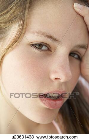 Stock Photo - Portrait Of Teenage Girl Looking Frustrated. Fotosearch