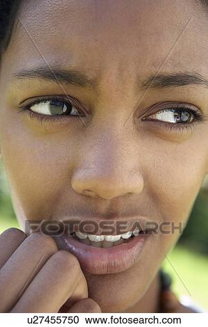 Stock Image - Portrait Of Teenage Girl Looking Worried. Fotosearch