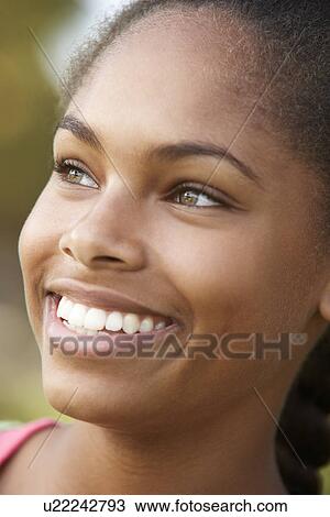 Stock Image - Portrait Of Teenage Girl Smiling. Fotosearch