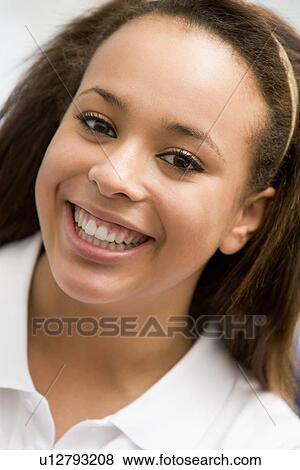Stock Photo - Portrait Of Teenage Girl Smiling. Fotosearch