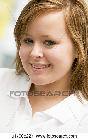 Stock Photo - Portrait Of Teenage Girl Smiling. Fotosearch