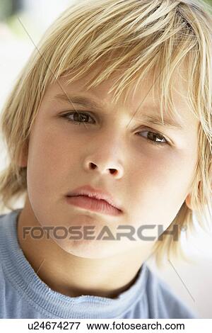 Portrait Of Young Boy Frowning View Large Photo Image Stock Photo - Portrait Of Young Boy Frowning. Fotosearch