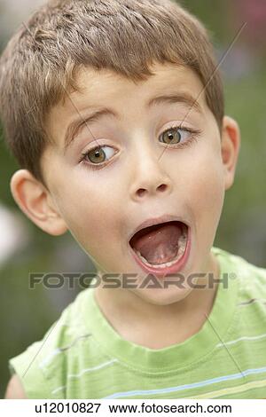 Portrait Of Young Boy Looking Surprised View Large Photo Image Stock Photo - Portrait Of Young Boy Looking Surprised. Fotosearch