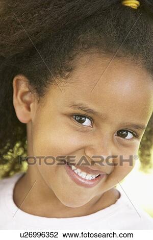 Stock Image - Portrait Of Young Girl Smiling. Fotosearch