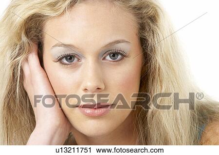 Stock Image - Portrait Of Young Woman Looking At Camera. Fotosearch