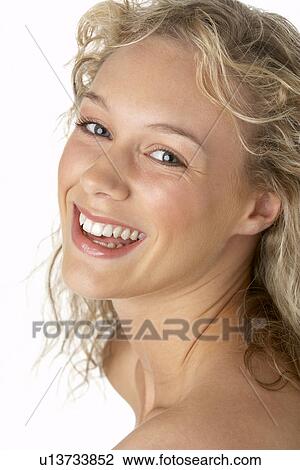 Stock Image - Portrait Of Young Woman Looking At Camera. Fotosearch