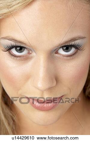 Stock Image - Portrait Of Young Woman Looking At Camera. Fotosearch