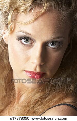 Stock Image - Portrait Of Young Woman Looking At Camera. Fotosearch