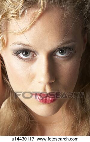 Stock Photo - Portrait Of Young Woman Looking At Camera. Fotosearch