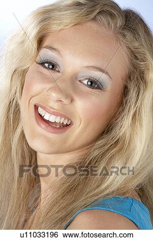 Stock Photograph - Portrait Of Young Woman Looking At Camera. Fotosearch