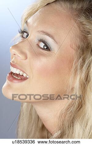 Stock Photograph - Portrait Of Young Woman Looking At Camera. Fotosearch
