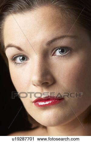 Stock Image - Portrait Of Young Woman With Red Lipstick. Fotosearch