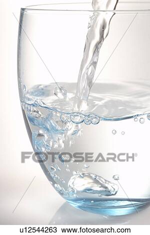 Stock Image - Pouring A Glass Of Water. Fotosearch