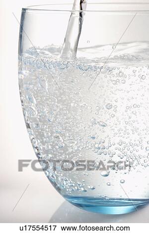 Pouring A Glass Of Water View Large Photo Image Stock Photo - Pouring A Glass Of Water. Fotosearch