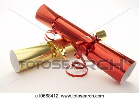 Stock Image - Red And Gold Christmas Crackers Against White Background. Fotosearch